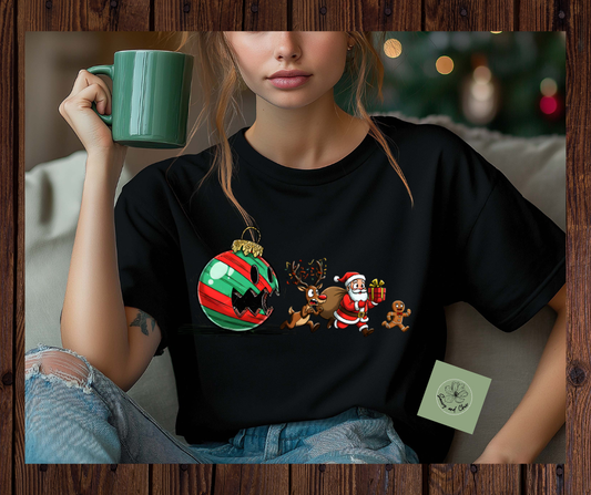 Funny Christmas Shirt – Ornament Chasing Santa, Reindeer & Gingerbread Man | Hilarious Holiday Tee for Adults