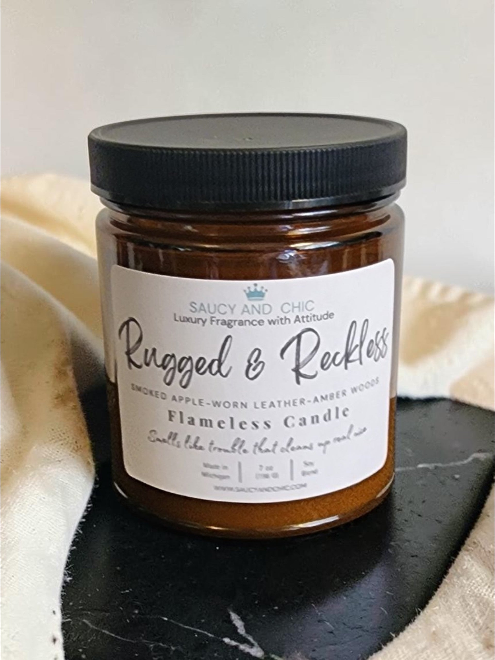 Rugged and Reckless cherrywood and suede wickless candle by Saucy and Chic