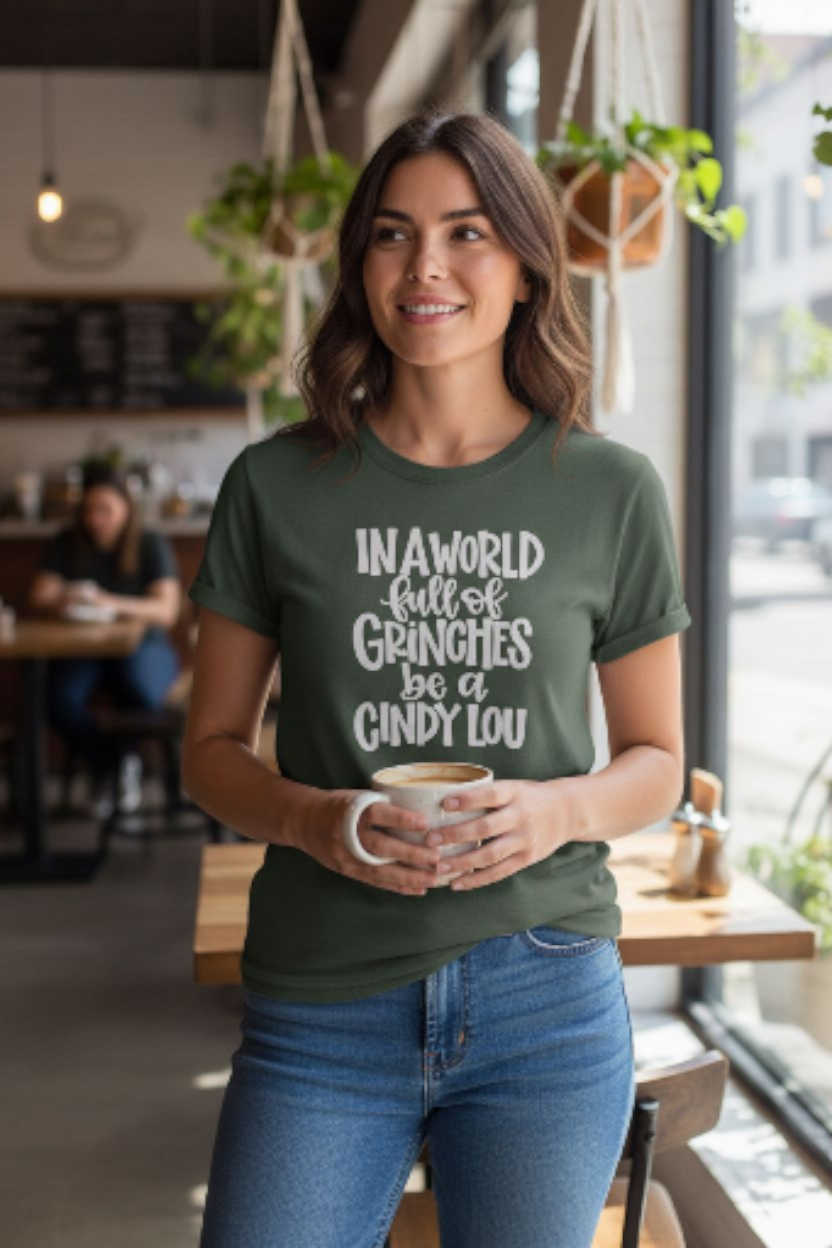 In a World Full Grinches Be a Cindy Lou T-Shirt – Cute Christmas Graphic Tee | Holiday Positive Quote Shirt